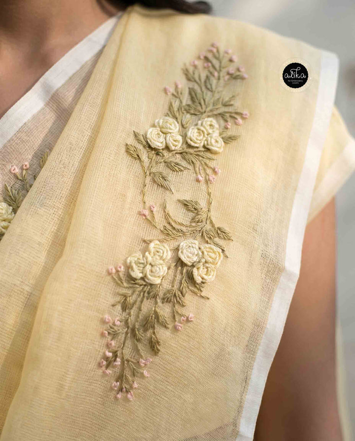 Light Yellow Kota Saree with Floral Hand Embroidery and tassels