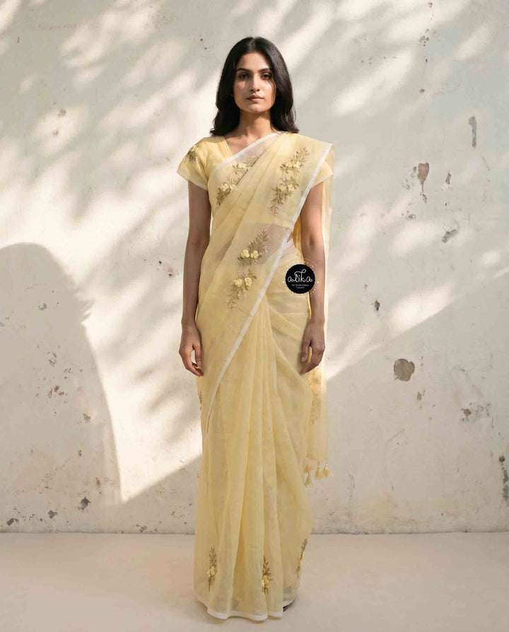 Light Yellow Kota Saree with Floral Hand Embroidery and tassels