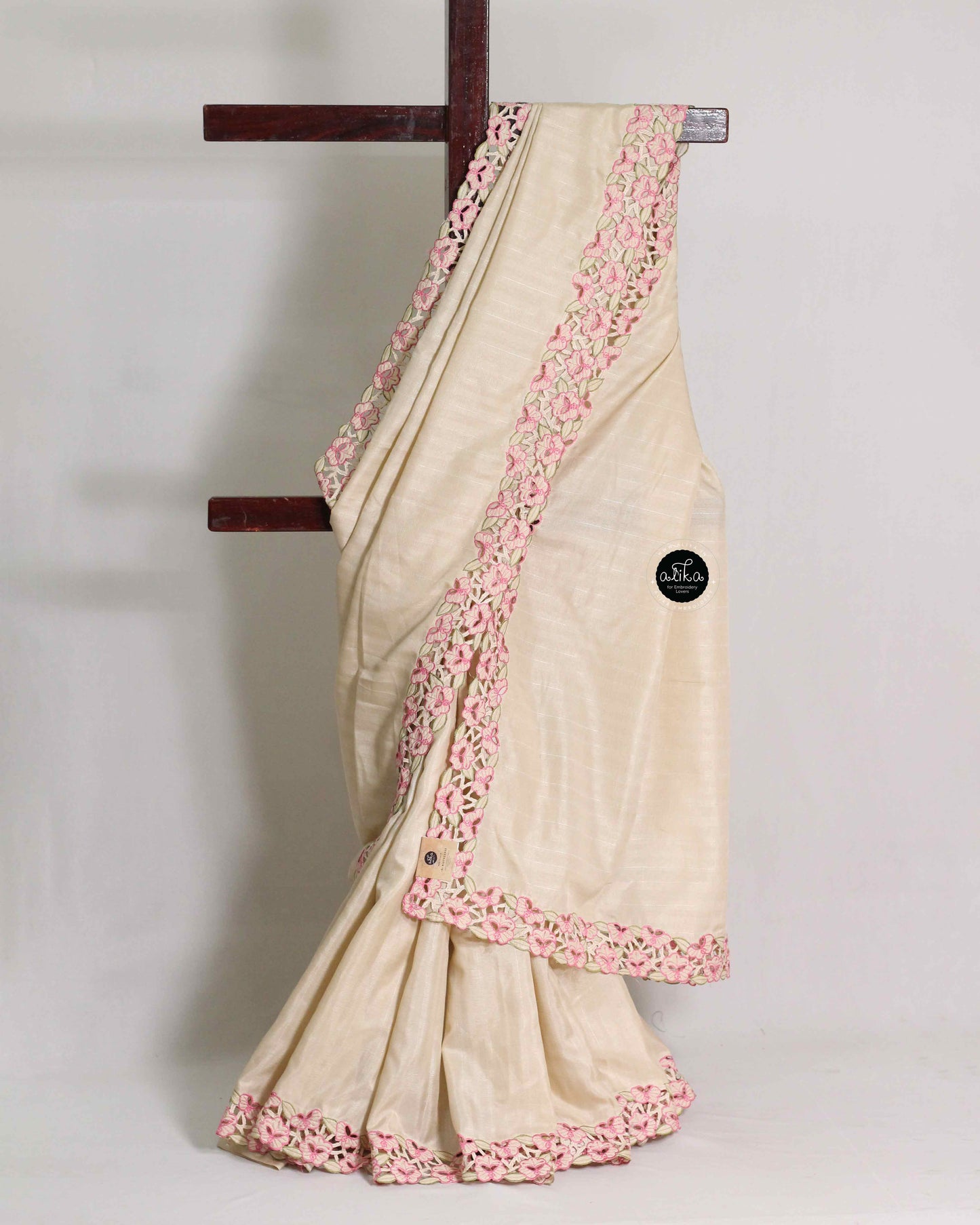 Beige Semi Silk Saree with Pink Floral Full Border Cutwork