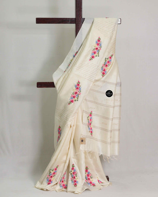 Off white tussar silk saree with multicolour floral hand embroidery and sequin work
