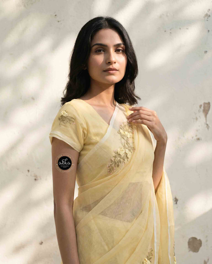 Light Yellow Kota Saree with Floral Hand Embroidery and tassels