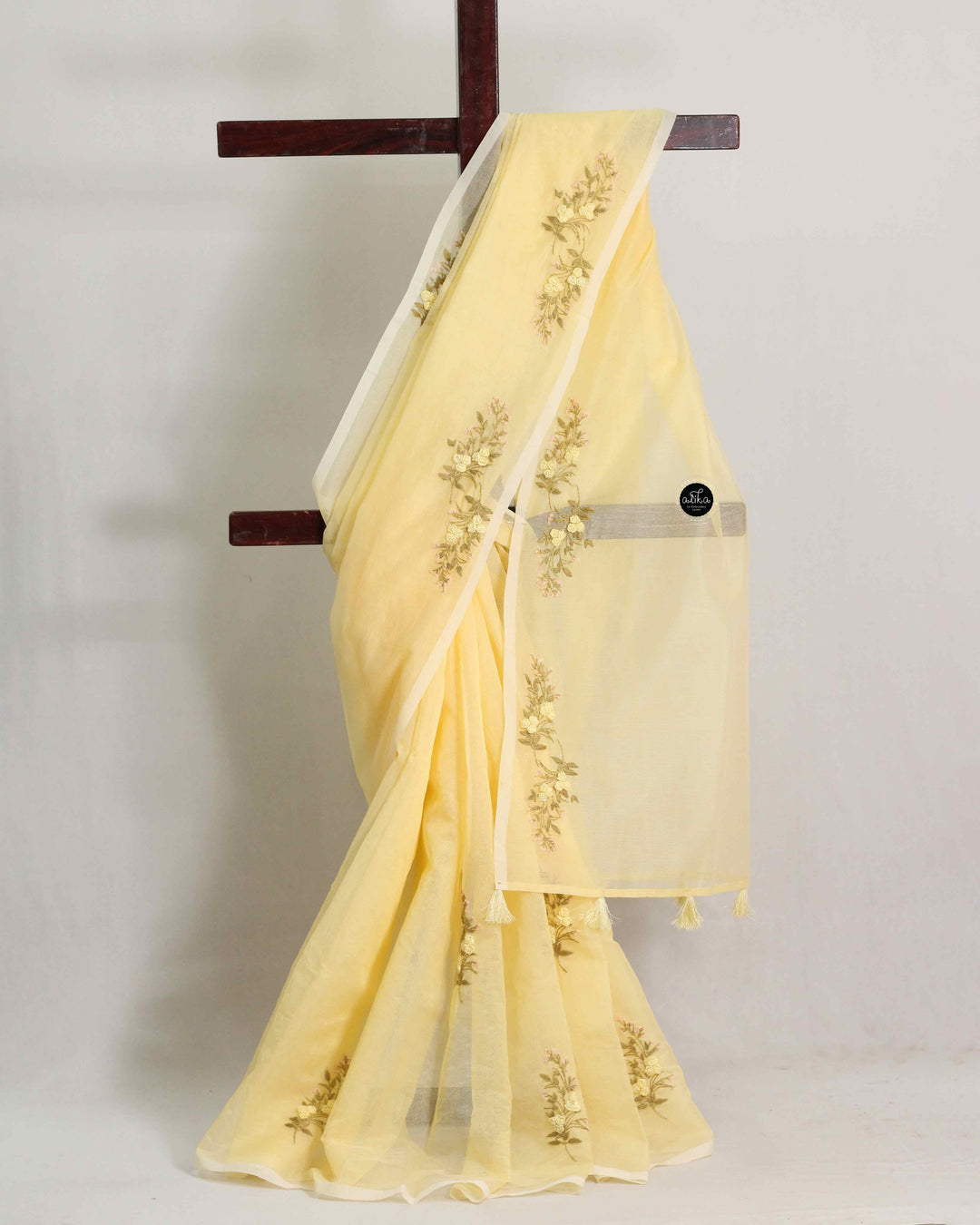 Light Yellow Kota Saree with Floral Hand Embroidery and tassels