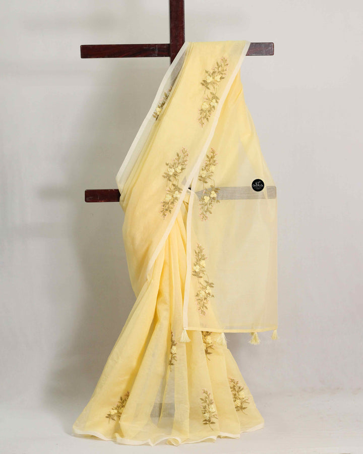 Light Yellow Kota Saree with Floral Hand Embroidery and tassels
