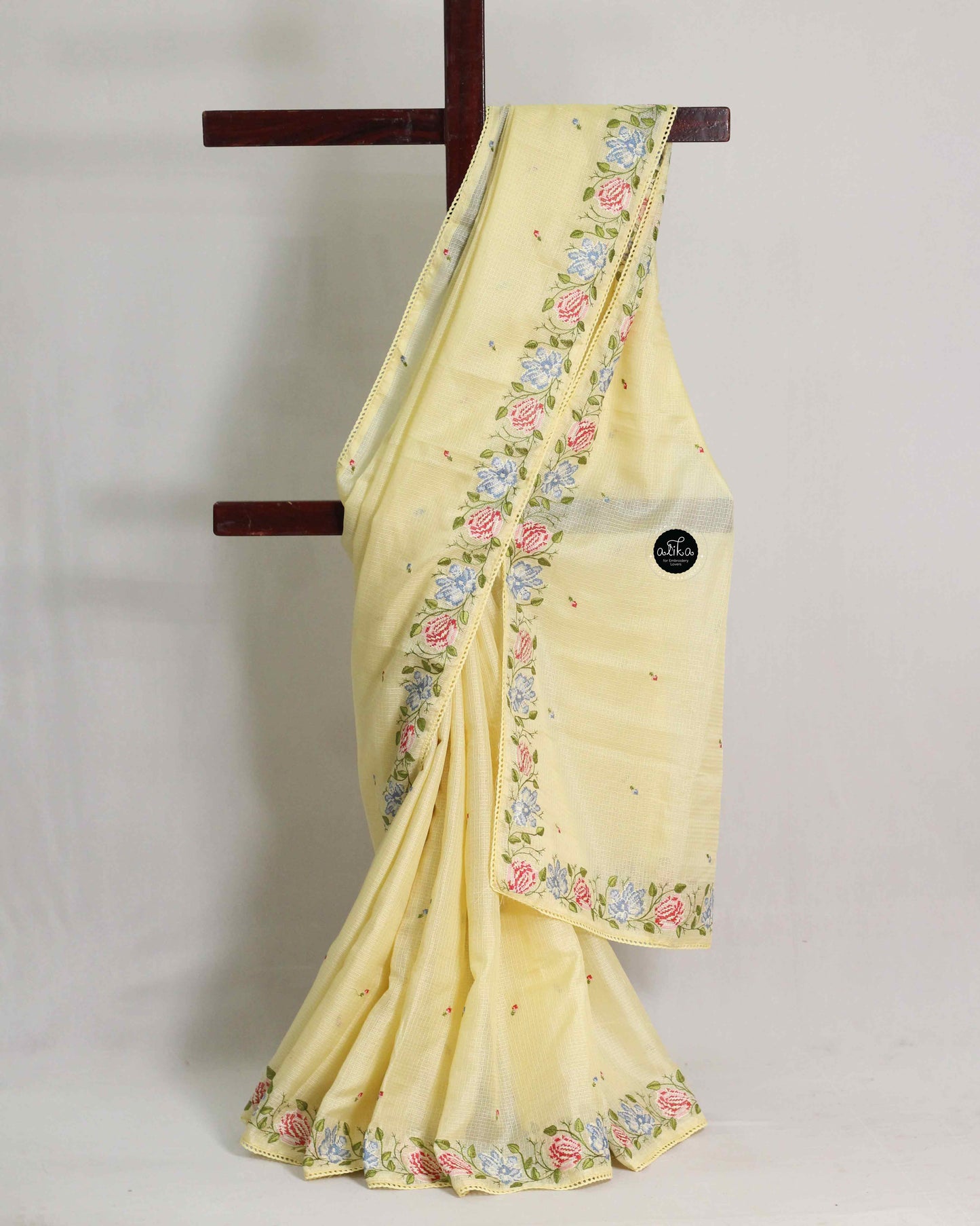 Pastel Yellow Silky Kota Saree with Floral Machine Embroidery & Lace Piping