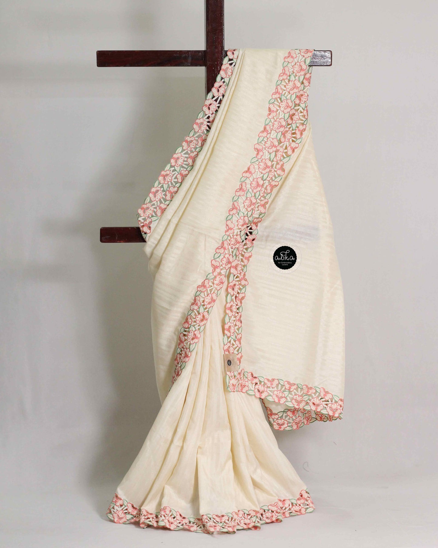 Ivory Semi Silk Saree with Peach Floral Full Border Cutwork