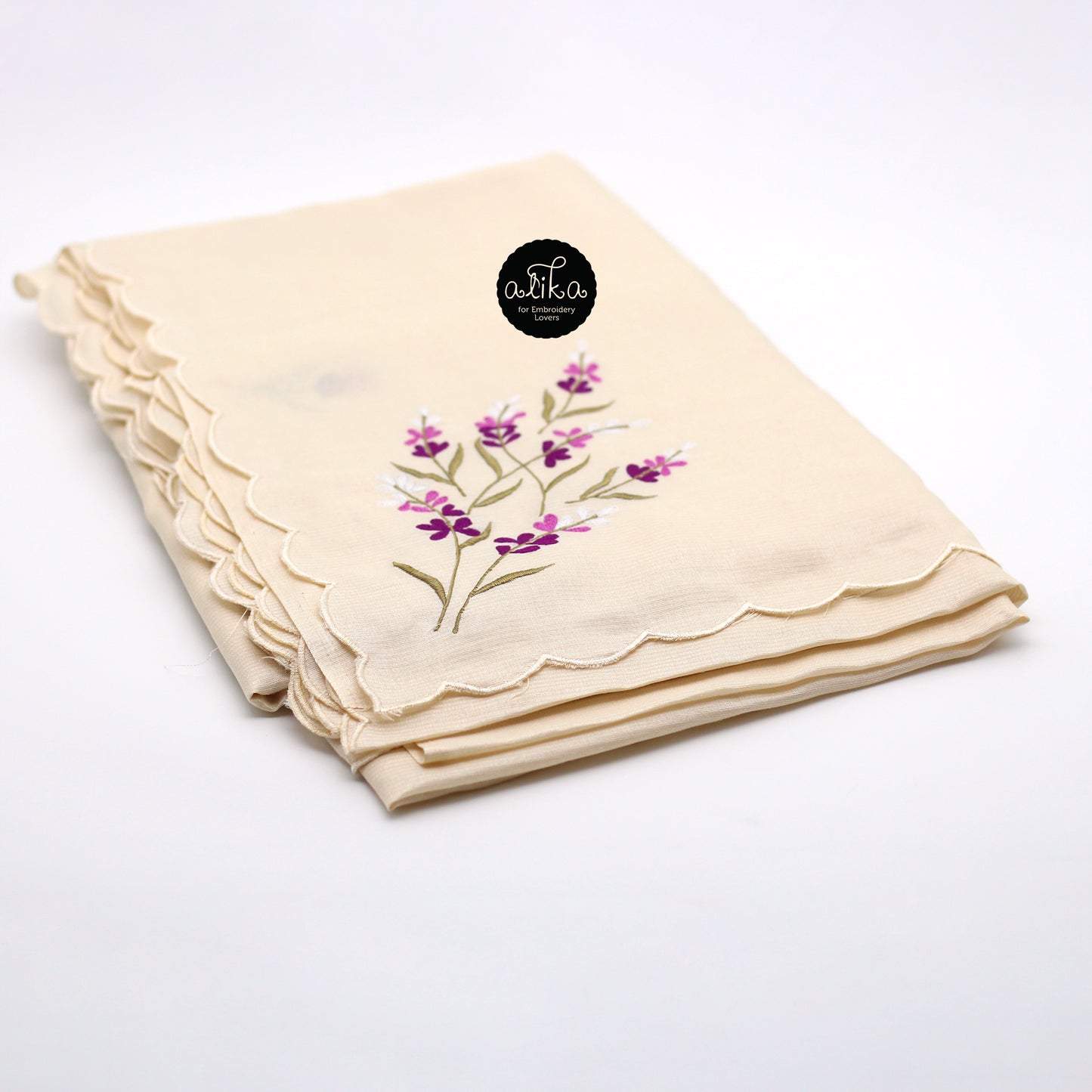 Cream shade striped semi-silk saree with floral bunches in purple shade