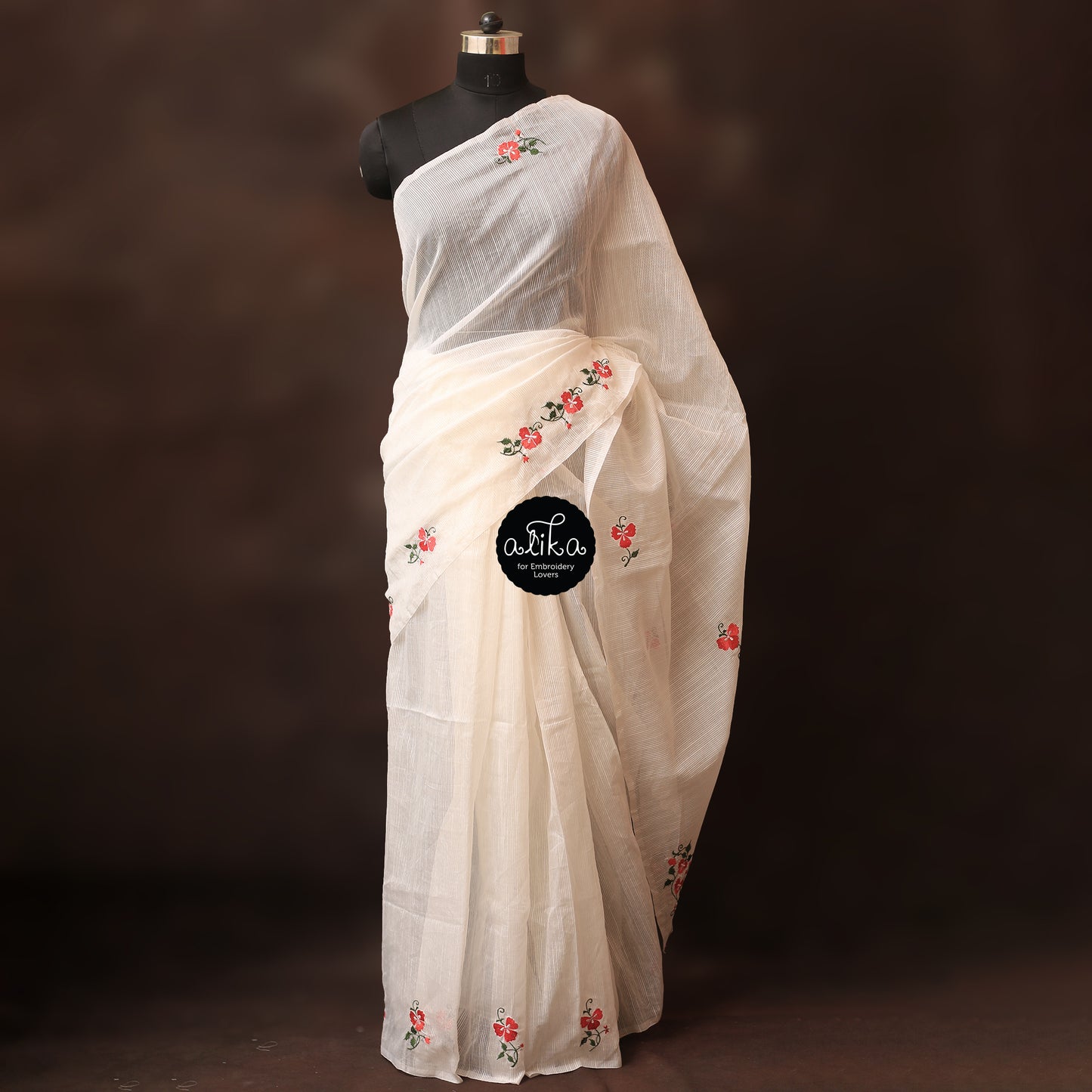 White striped kota saree with dual shade floral embossed embroidery scattered across saree, blouse self-colour with embroidery on sleeves